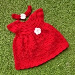 Red woolen frock with hair band.