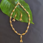 Gold dholki beads necklace set