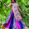 Red circular traditional embroidered panel top paired with multicolor flairy skirt