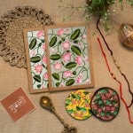 These beautiful and yet colorful diaries and coasters for your colorful bond this festive season Set of 2 Handcrafted Diary 1 Handpainted Wooden Tray 2 wooden Coasters paired with 2 Rakhi