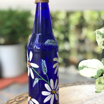 Blue Hanpainted Bottle With White Flowers. 1