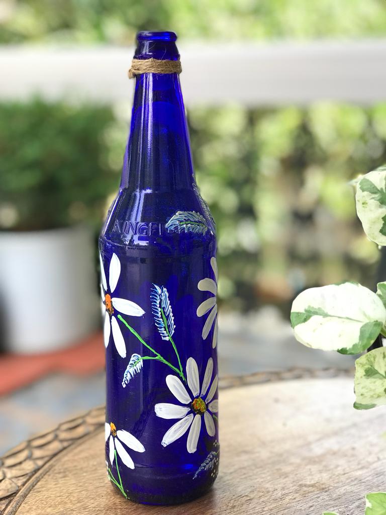 Blue Hanpainted Bottle With White Flowers. 1