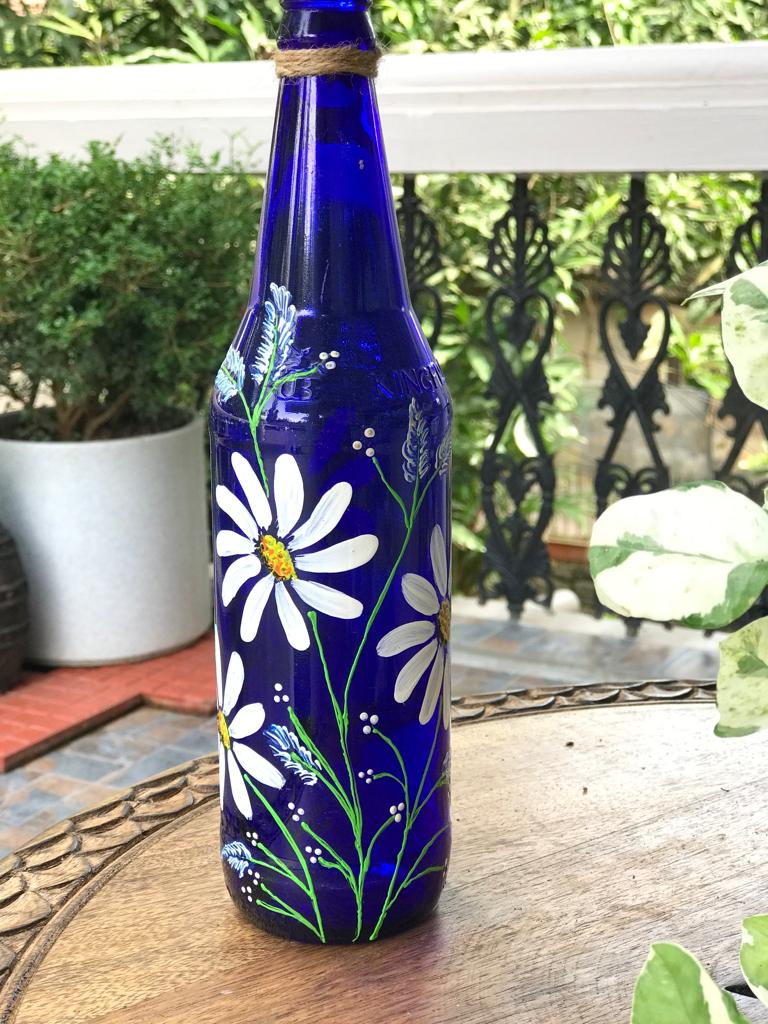 Blue Hanpainted Bottle With White Flowers