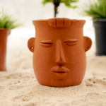 Handmade terracotta table top planter baby face